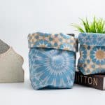 Fabric storage boxes from the 'نقوش' collection with geometric patterns, perfect for festive organization.