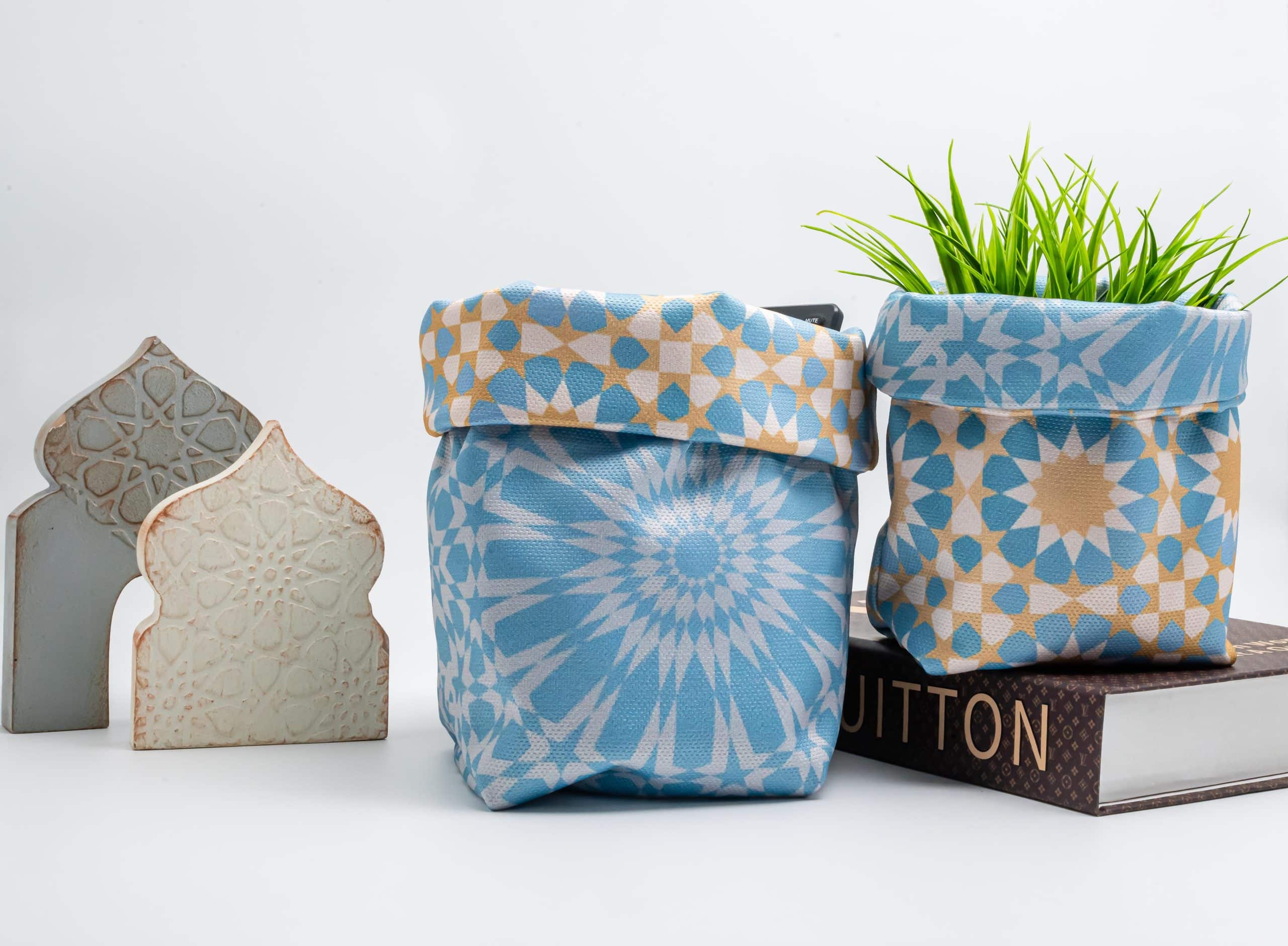 Ramadan Fabric Storage Box Set – "نقوش" Collection 4 Fabric storage boxes from the 'نقوش' collection with geometric patterns, perfect for festive organization.