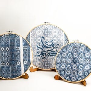 Wooden embroidery hoop set with bold geometric patterns from the 'زهرا' collection for festive wall decor.