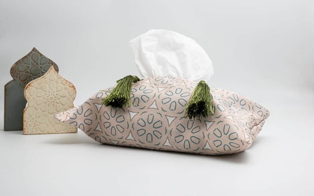 Ramadan-themed tissue box cover with lantern motifs and tassels, part of the 'Sokoon' collection, made from soft fabric.
