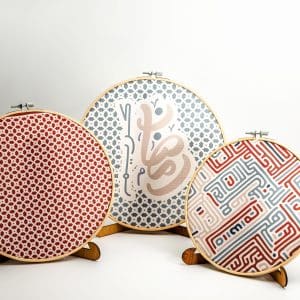 Wooden embroidery hoop set with Kufic-inspired patterns from the 'كوفي' collection.