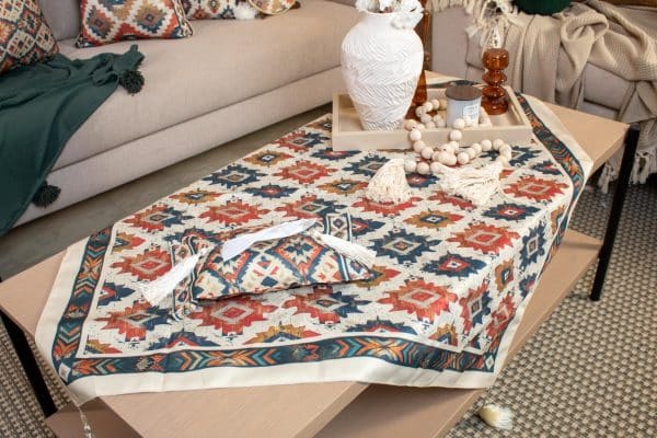 Square tablecloth with ethnic patterns styled on a coffee table.