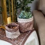 Storage box set with Arabic calligraphy from the 'أثر' collection in mocha tones.