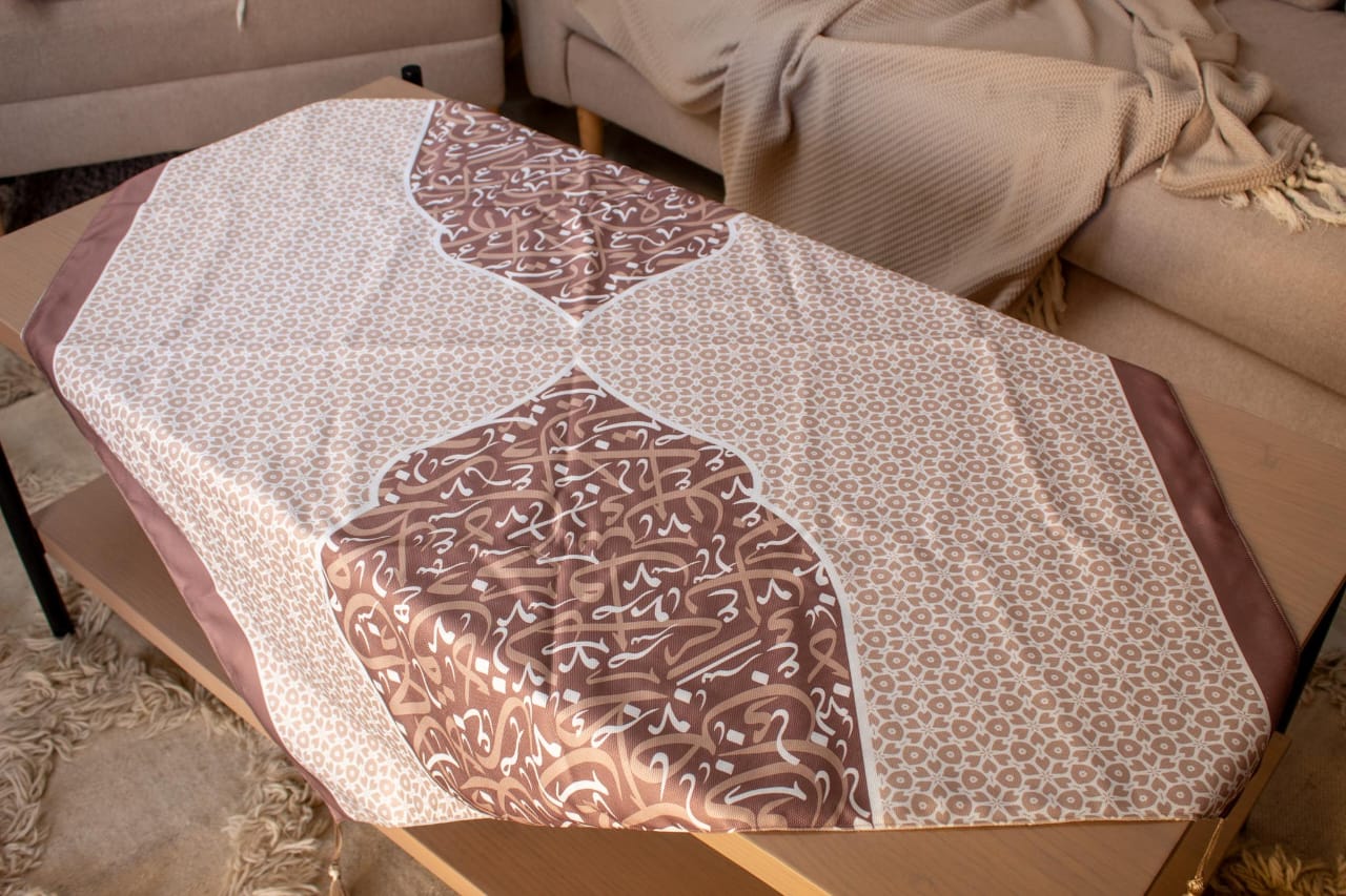 Ramadan Square Table Cover with Arabic Calligraphy – "أثر" Collection (Mocha Edition) 4 Square table cover with Arabic calligraphy from the 'أثر' collection in mocha tones, ideal for Ramadan decor.
