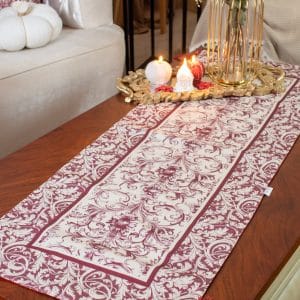 Luxurious burgundy dual-sided runner styled on a coffee table with candles and floral decor.