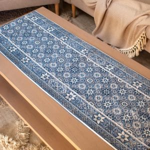 Double-sided table runner from the 'زهرا' collection, featuring geometric patterns and tassels.