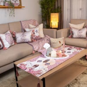 Double-sided table runner with floral patterns and tassels from the 'روبا' collection.