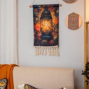 Wall hanging décor with fanous motifs from the 'زينة' collection for Ramadan.