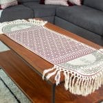 Double-sided table runner with minaret-inspired designs from the 'مآذن' collection.