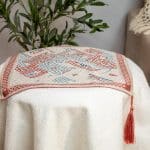 Side table cover with Kufic patterns from the 'كوفي' collection.