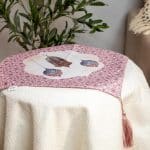 Floral side table cover from the 'روبا' collection, ideal for Ramadan decor.