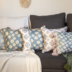 Decorative cushions with floral and geometric patterns from the ‘ربيع’ collection.