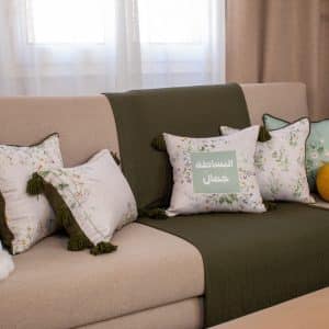 Decorative cushions with floral and botanical patterns from the ‘ورد’ collection.